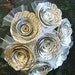 7 spiral rolled book page roses bouquet with tulling added and burlap wrapped handle