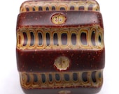 American Trade Bead - Nevada - Cylinder bead. Hollow blown carved boro glass lampwork.