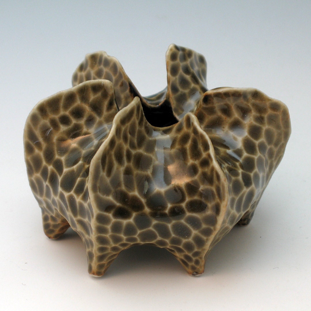 Porcelain urchin vessel in olive green celadon