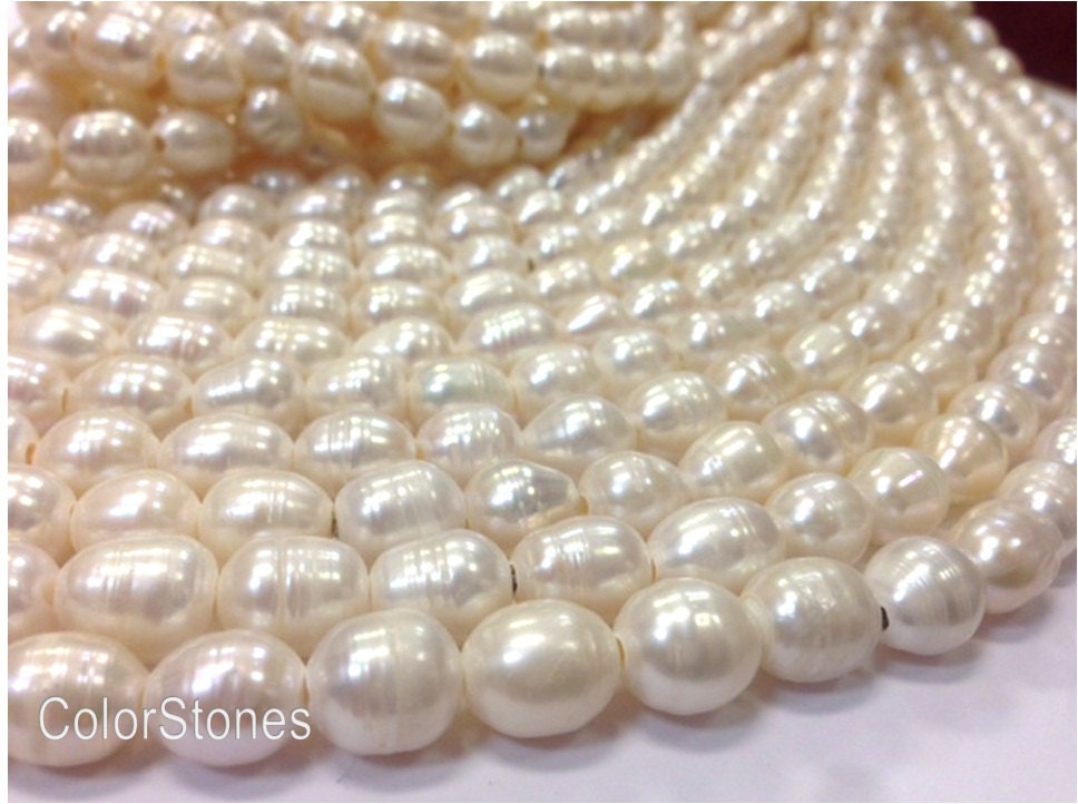 15.5 inch 10x11-12 mm Large Hole Freshwater Pearl Rice Beads - White - 2.5 mm hole (W5502G48)
