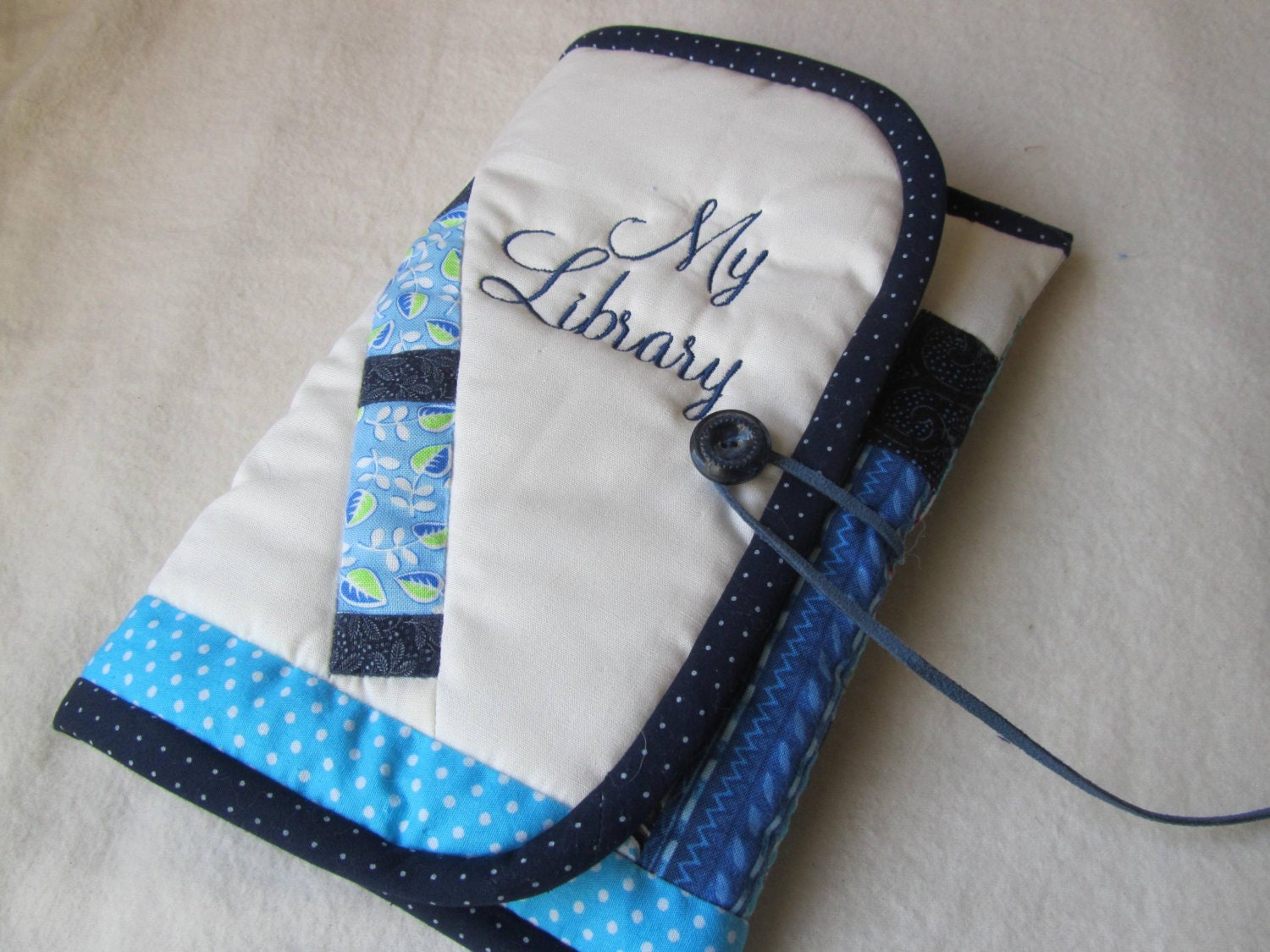 Ereader Cover with Blue Books on a Shelf