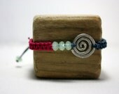 bracelet ,macrame beaded with a sterling silver handmade spiral..."spiral of life" adjustable friendship bracelet... hammered 925 helix...