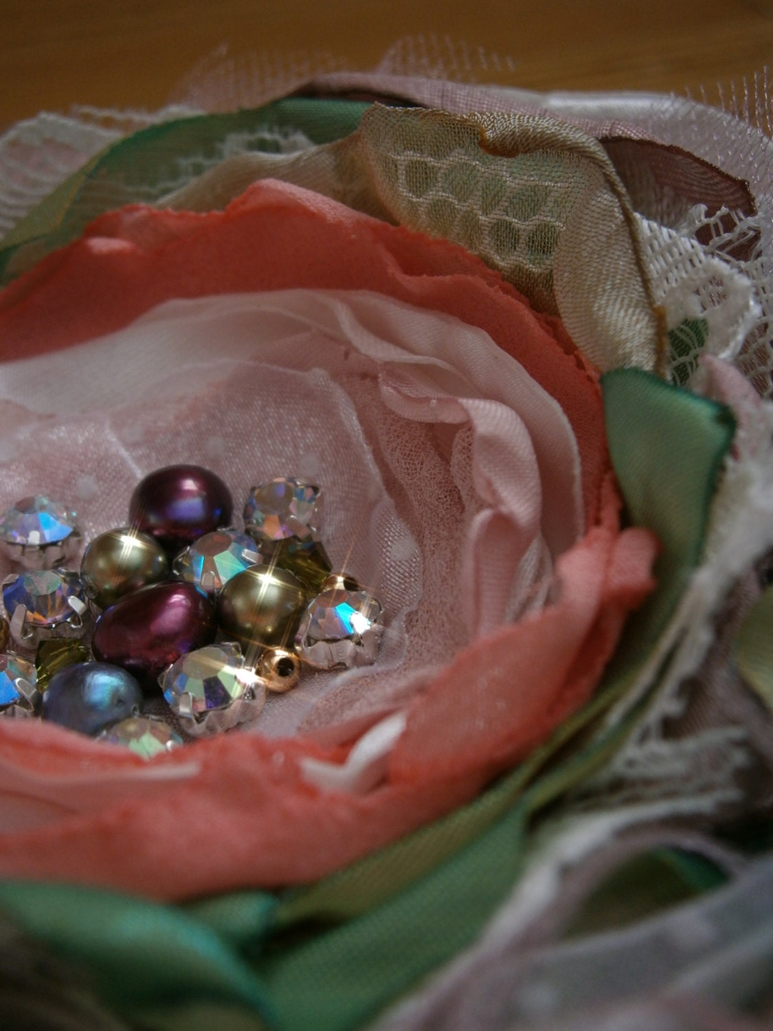 Big flower brooch in pink, mauve, white and green with pearls and crystals