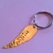 Alis Volat Propriis Hand Stamped Wing Shaped Keychain