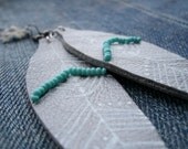 silver leather feather earrings with geometric design and turquoise accent handmade from salvaged material