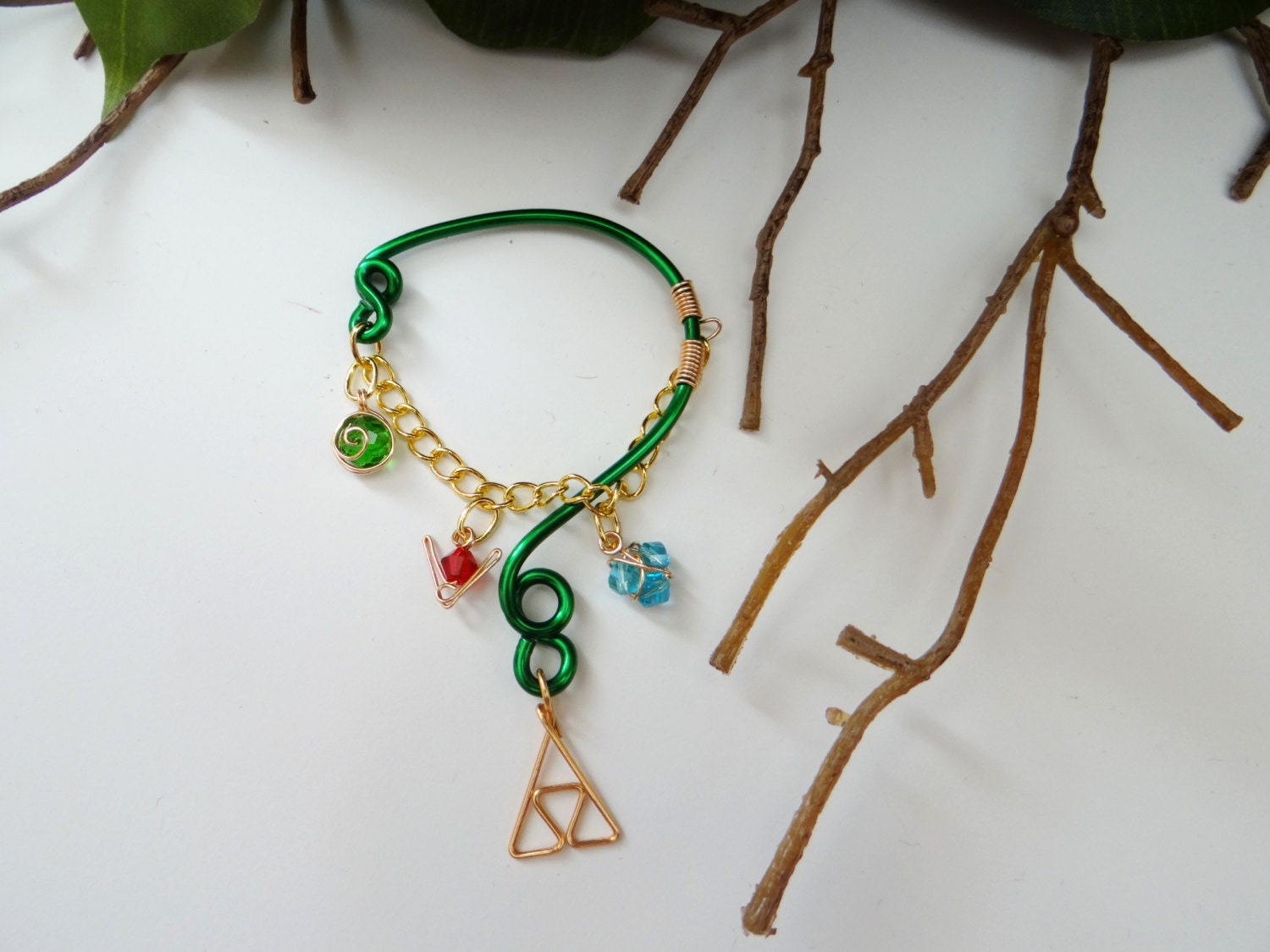 The Legend of Zelda's Wise Ear Bend with Hanging Spiritual Stones and Triforce