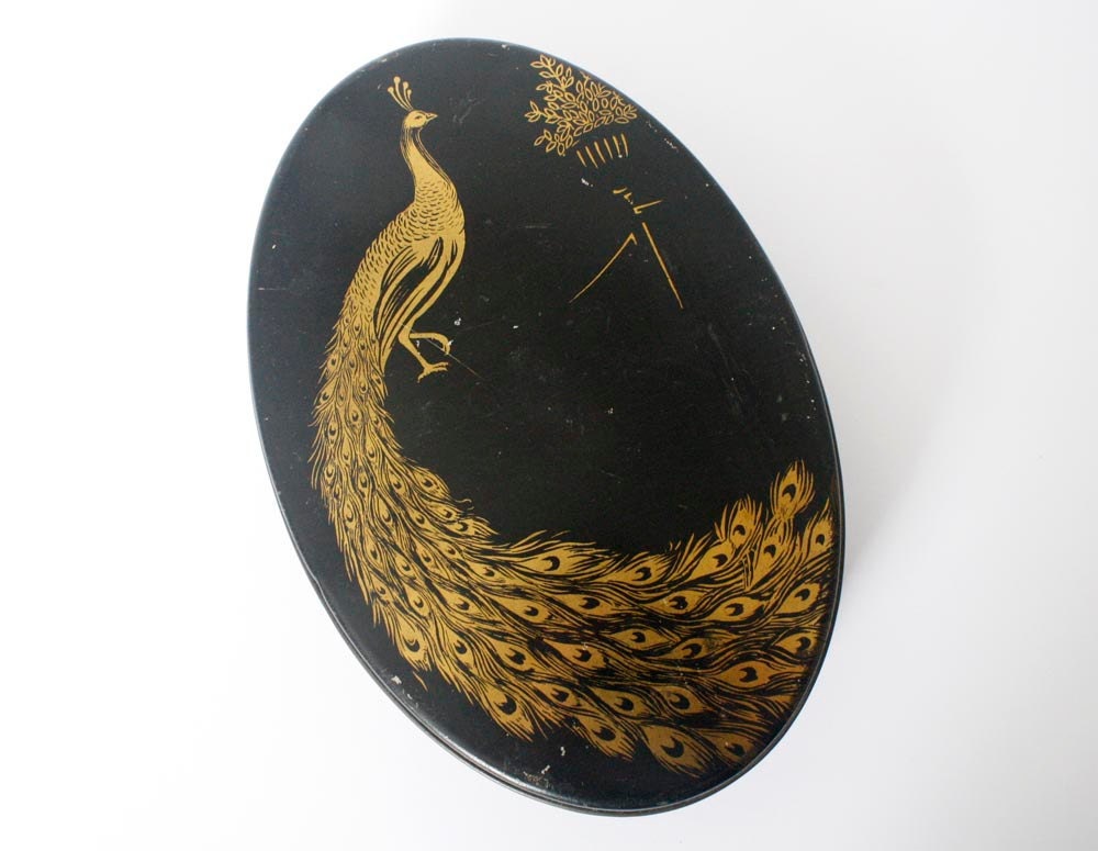 Vintage black and gold peacock tin, 1920s