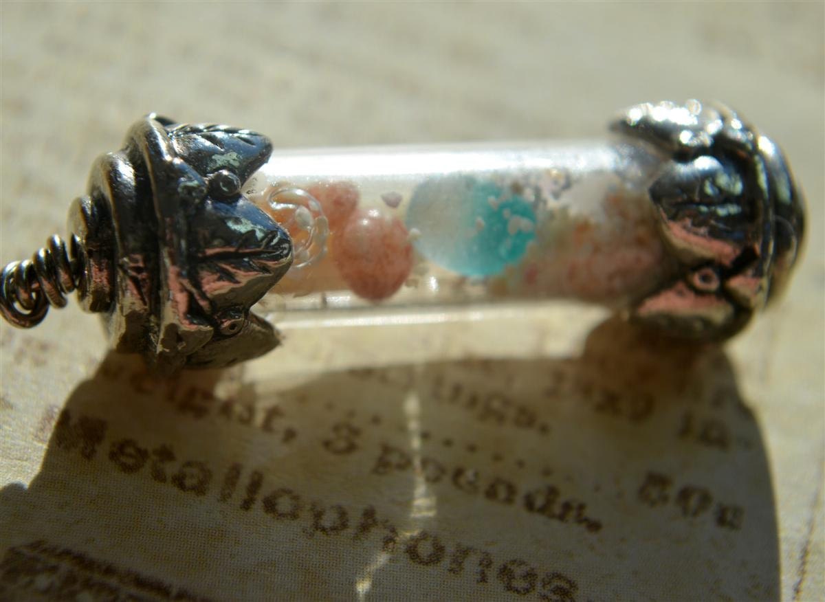 Tiny glass bottle with mini beach finds inside, beach jewelry, silver capped bottle