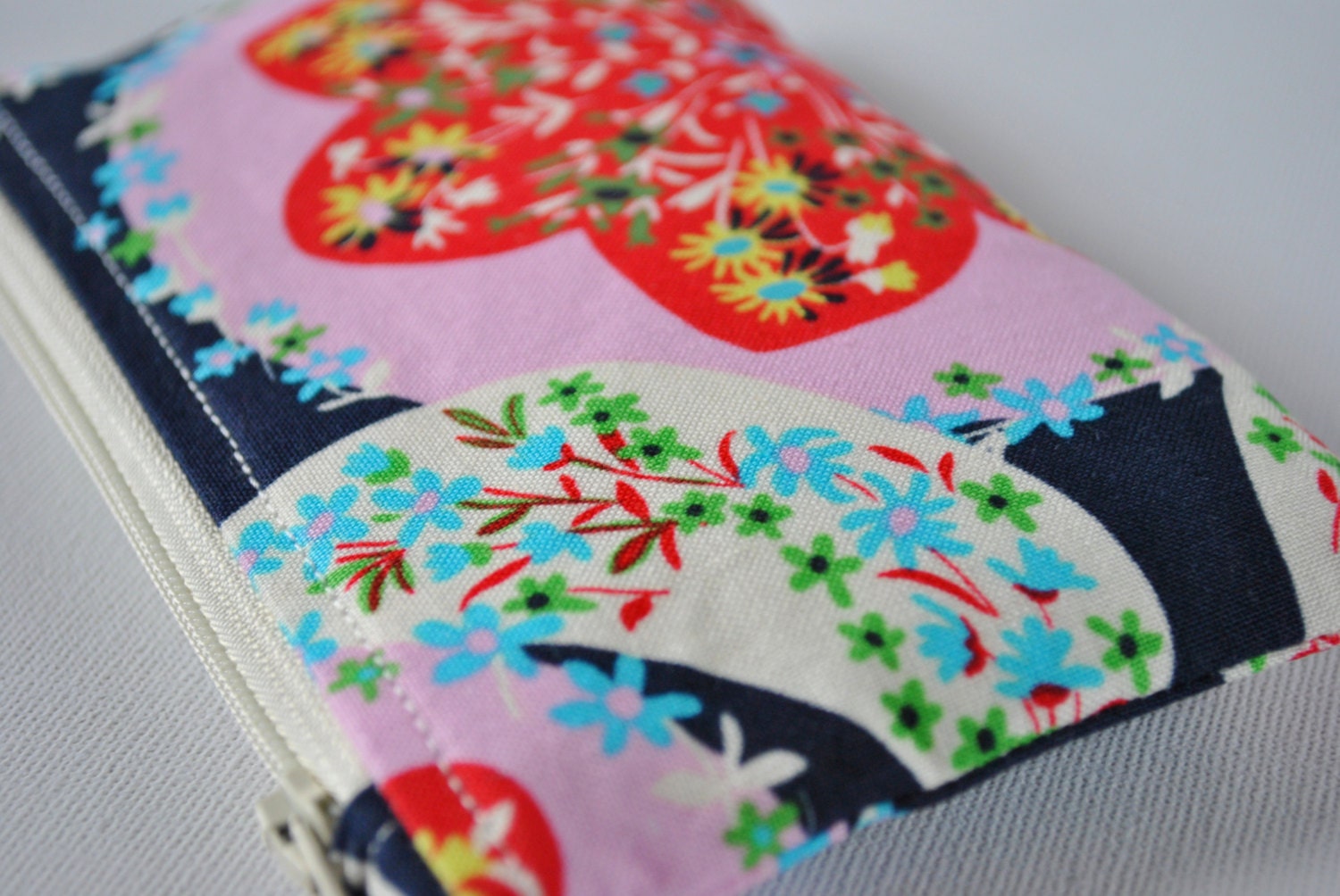 Coin purse wallet: Amy Butler Retro style flower print in navy blue.pink,red and green.