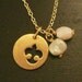 Be kind. Handmade brass bird motif logo necklace with white beads