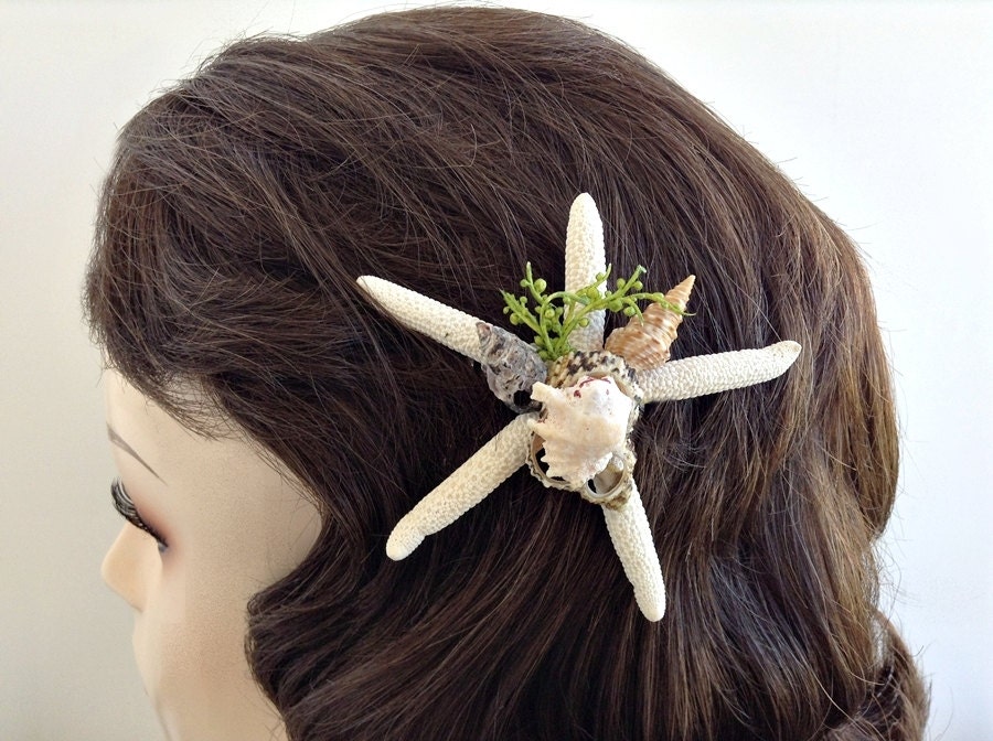Finger starfish hair comb with a center point of multi small natural seashells .