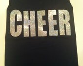 Navy blue tank with  Cheer written across the chest in silver glitter letters.