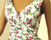 A limited edition floral 100% cotton 50s inspired cocktail dress