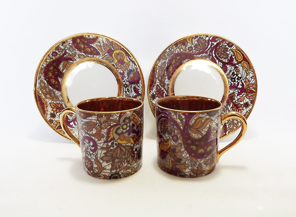 Two Paisley pattern porcelain espresso cups with gold interiors by Royal de luxe porcelaine, France