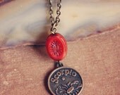 scorpio.  a brass astrological sign trinket necklace.