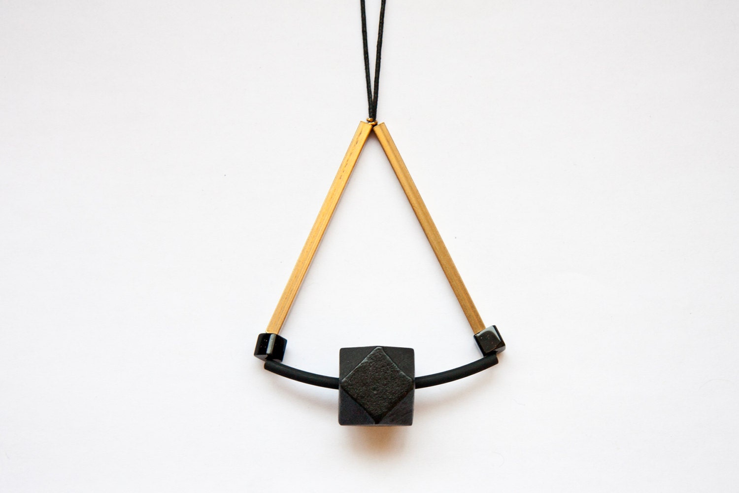geometric, tribal, brass tubes, black wood bead, golden brass tubes, black glass cube beads and black rope, long, beaded necklace.