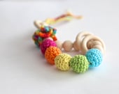 Teething toy rattle with crochet wooden beads and 3 wooden rings. Yellow, orange, blue, green, pink.