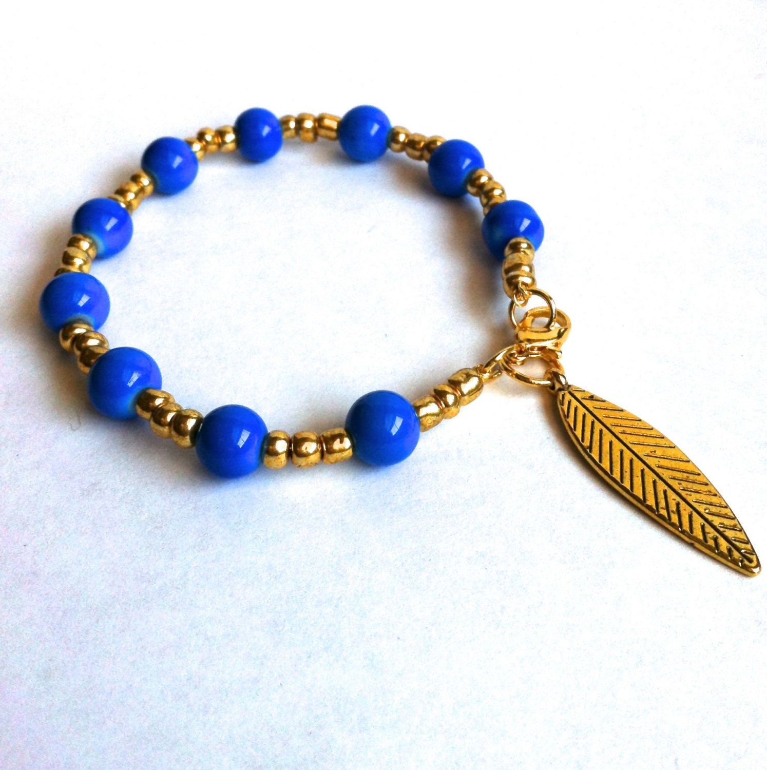 Blue & Gold Beaded Bracelet with Gold Leaf Charm - Wire Bracelet with Clasp - Layering Bracelet