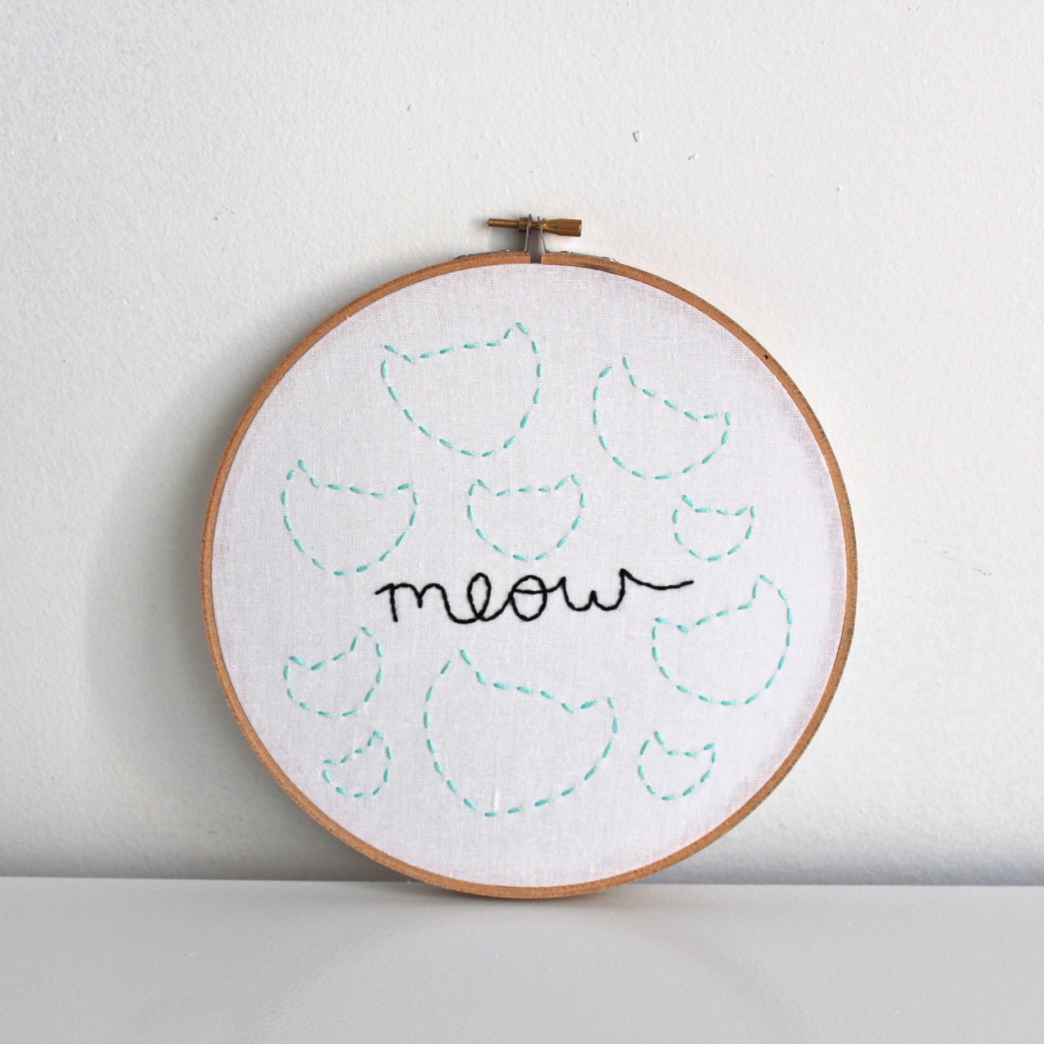 meow hand embroidered illustration in an 8 inch wooden hoop