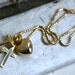 Sweet Vintage Love, Faith, and Charity Charm Necklace in 14K Yellow Gold.