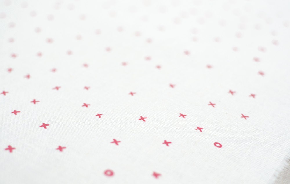 xox in camellia pink on natural hemp / organic cotton handprinted fabric panel