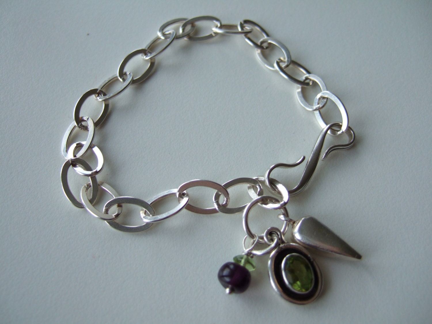 Peridot and amethyst sterling silver charm bracelet