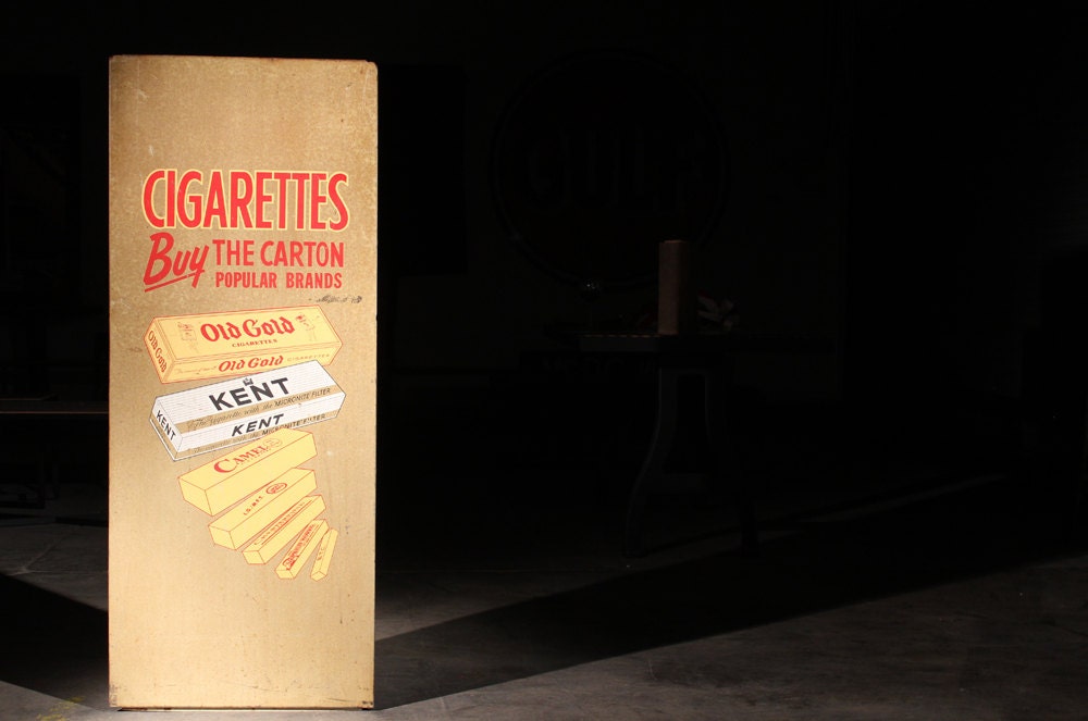 Vintage Metal "Cigarettes By The Carton" Sign