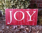 JOY on red painted and sanded rustic fence sign