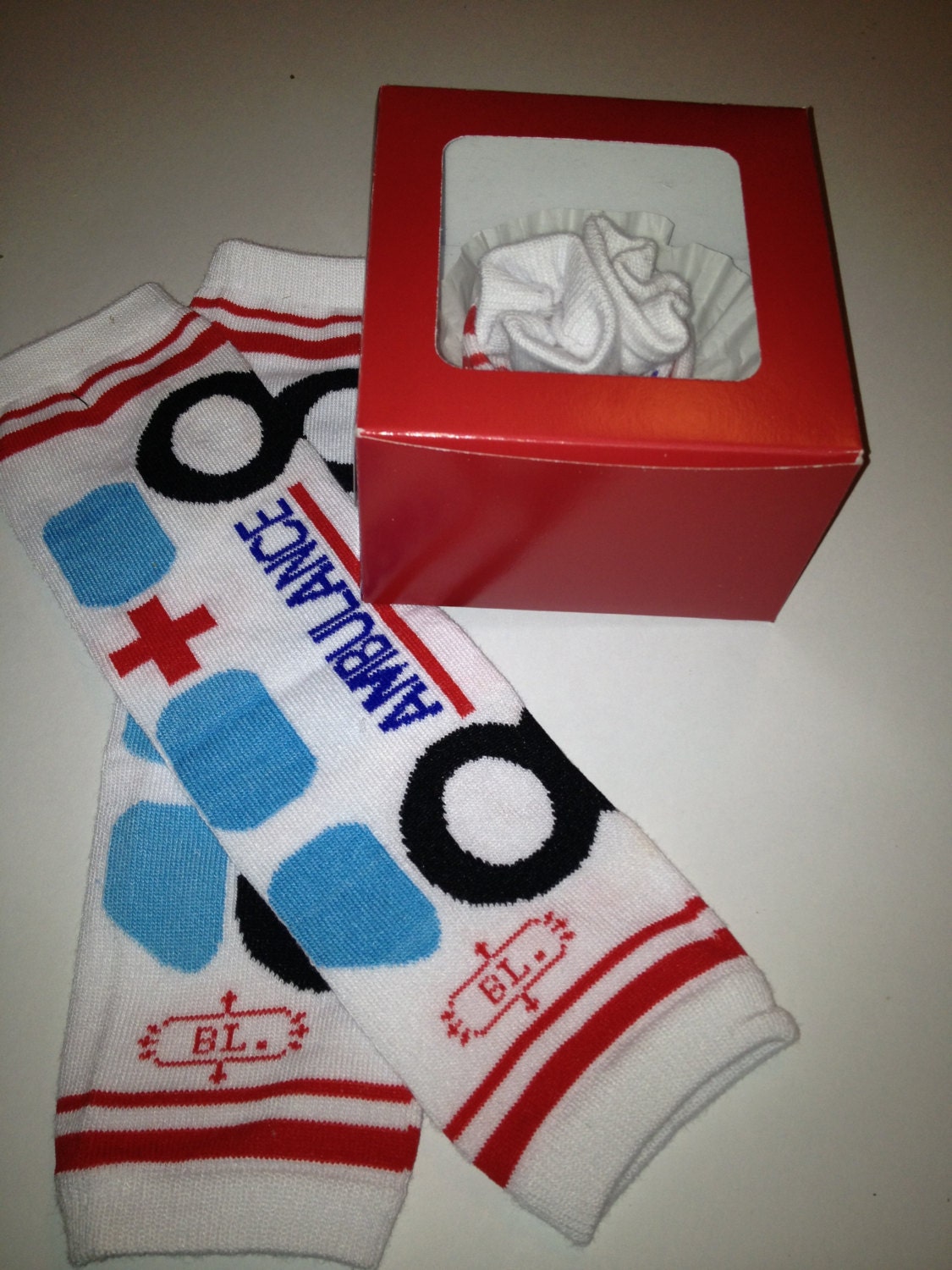 Paramedic Ambulance Toddler Leg Warmers Packaged like a Cupcake