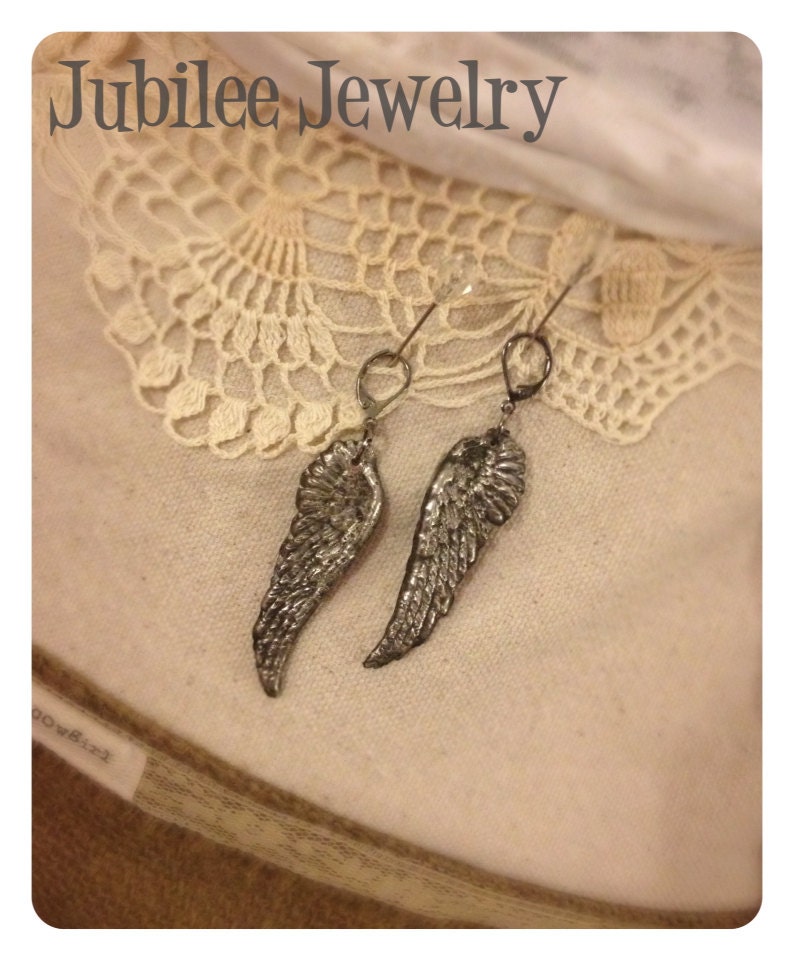 Hand soldered molten angel wing earrings 