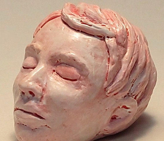 Red head  sleeping study -  decorative ceramic head sculpture in white and red glaze.