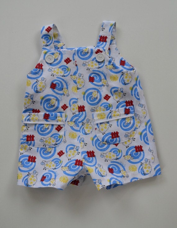Toddler boy's romper/jon-jon in classical style.  Whimsical sheep print.  Ideal for summer.  Inside leg snaps.  Sizes 1T, 2T, 3T, 4.