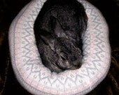 Ugli Donut rabbit bed for a small sized bunny pink and white Nordic lambswool and Angora