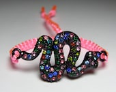 Snake bracelet with multicolored/rainbow rhinestones and neon pink macrame cord