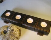 Rustic wood candle holder.