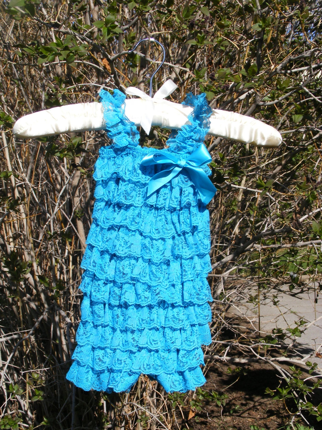 Turquoise Lace Romper with Bow.