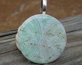 Pale colors, tiny script, Wood Pendant