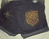 Destroyed cheetah cross studded shorts