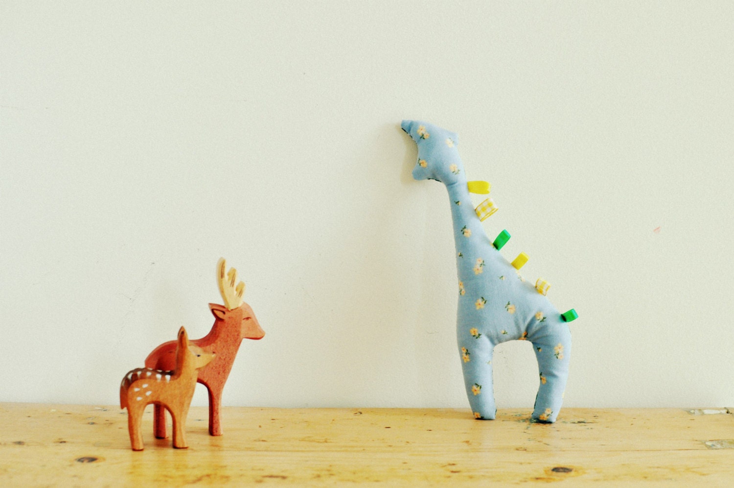 Jolly giraffe taggy tag animal baby toy with blue ditsy floral and green gingham fabric
