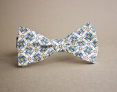 White Bow Tie with Blue and Yellow Geometric Shapes