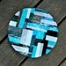 Fused Glass Dinner Plate: Blue, Turquoise, Gray, White, and Black Geometric Pattern on top of Light Scalloped Pattern