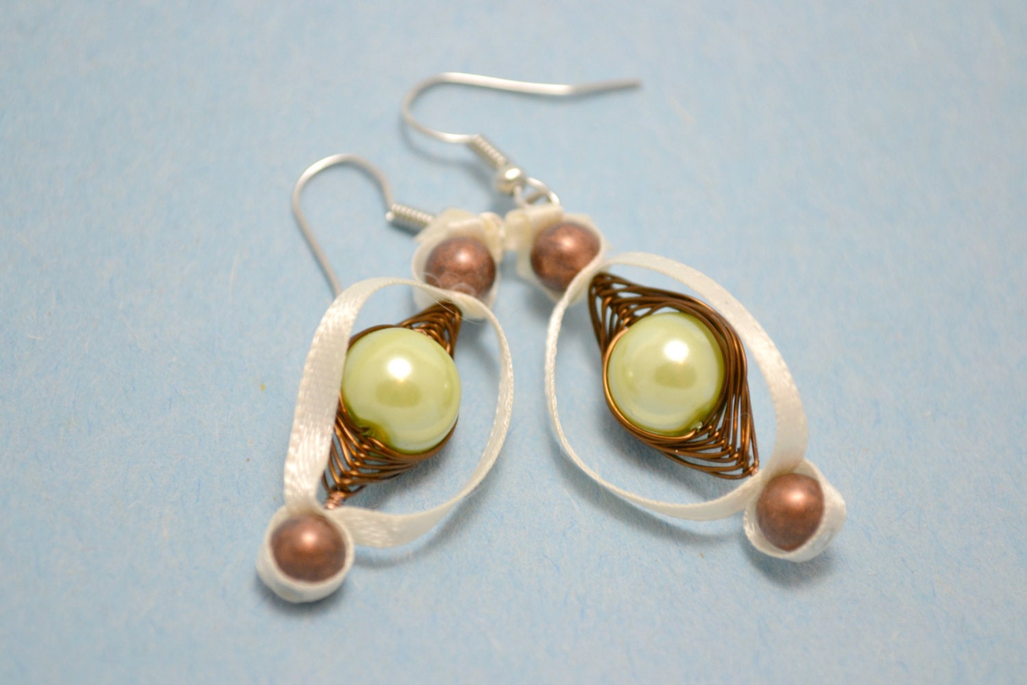 Wire wrapped mint green glass pearl earrings. Beaded ribbon jewelry. Dandle earrings. Copper beads. Ivory ribbon. Ships free