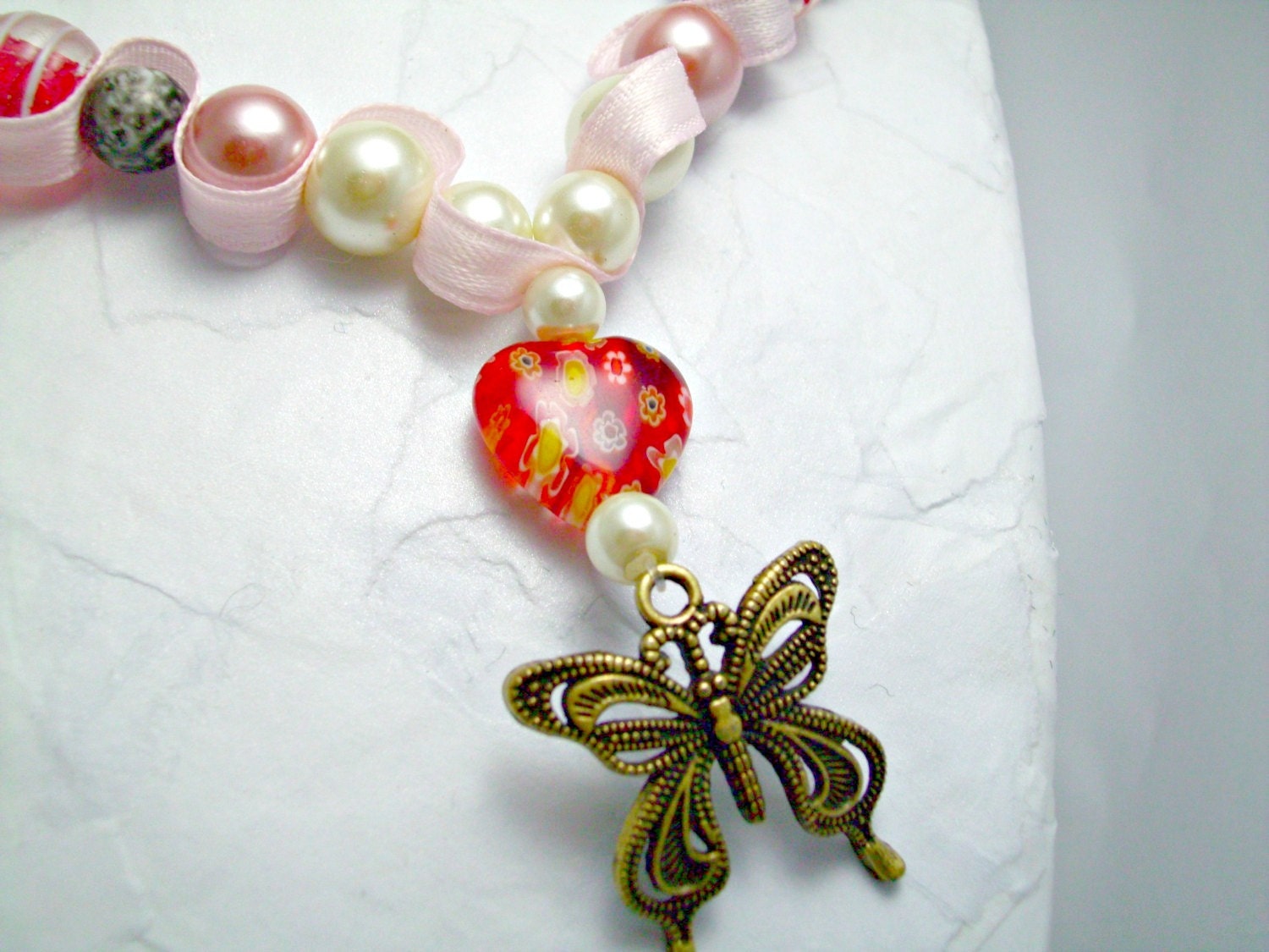 Butterfly and heart beaded ribbon necklace. Red, grey and pink beads. Bronze butterfly. Pink ribbon. Ships free.