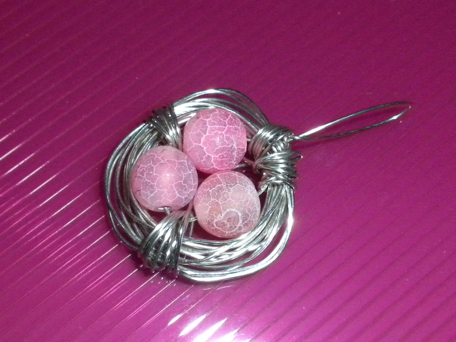 wire wrapped silver birdsnest necklace with pink frosted agate beads