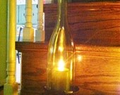 Yellow "chardonnay" candle hurricane made from handcut upcycled wine bottles.