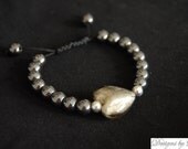 Women's Handmade, custom bracelet with Murano Style Glass Foil Heart (20mm) Bead in Smoke Gray with polished gun metal beads