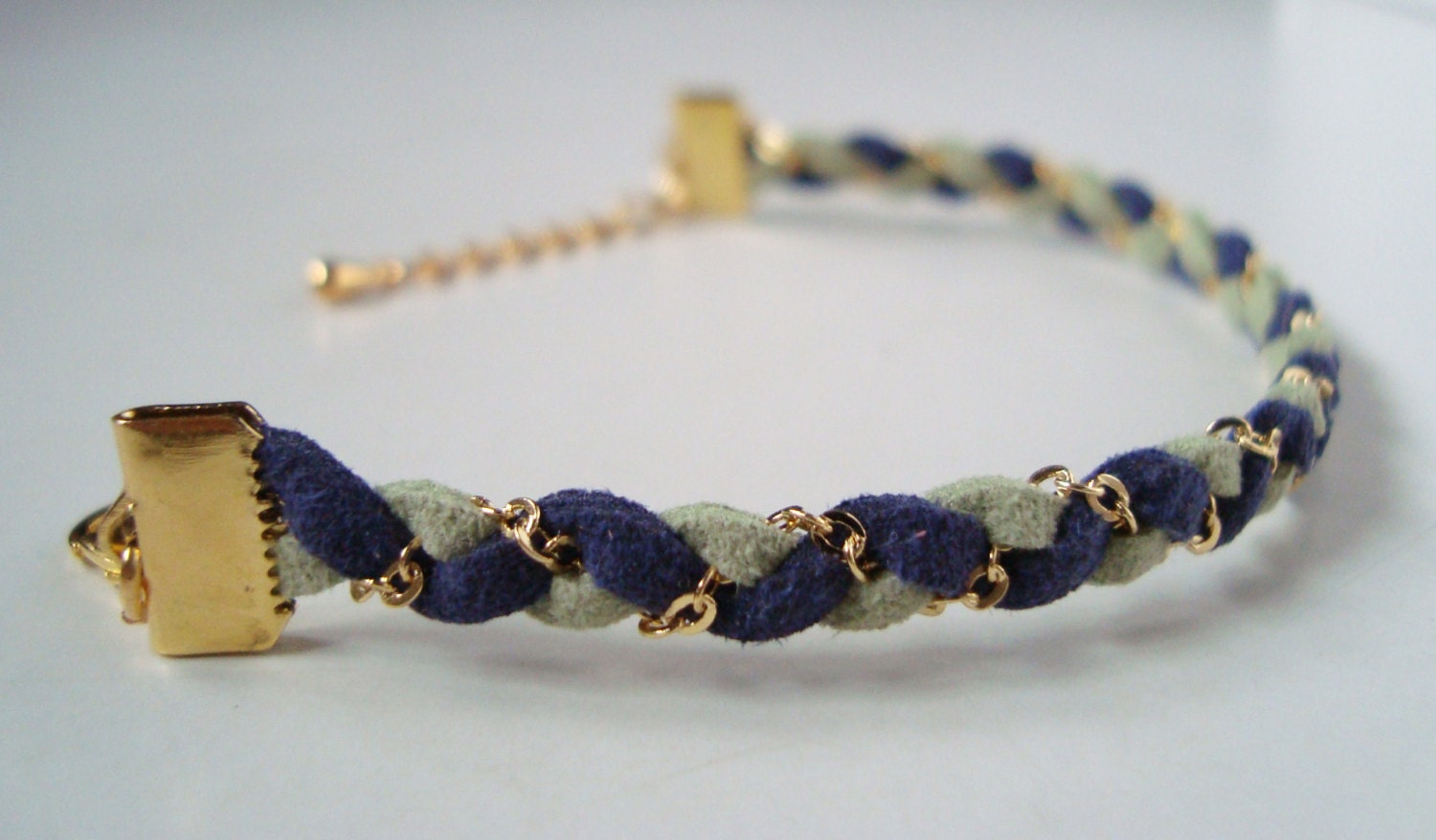Braided bracelet with gold chain and pale green and navy blue faux suede