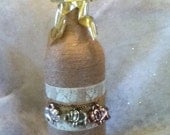 Twine wrapped wine bottle with Elephant decor