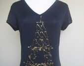 Eiffel Tower. This handmade Be Pin shirt is made with safety rustproof pins in gold. Size: Medium