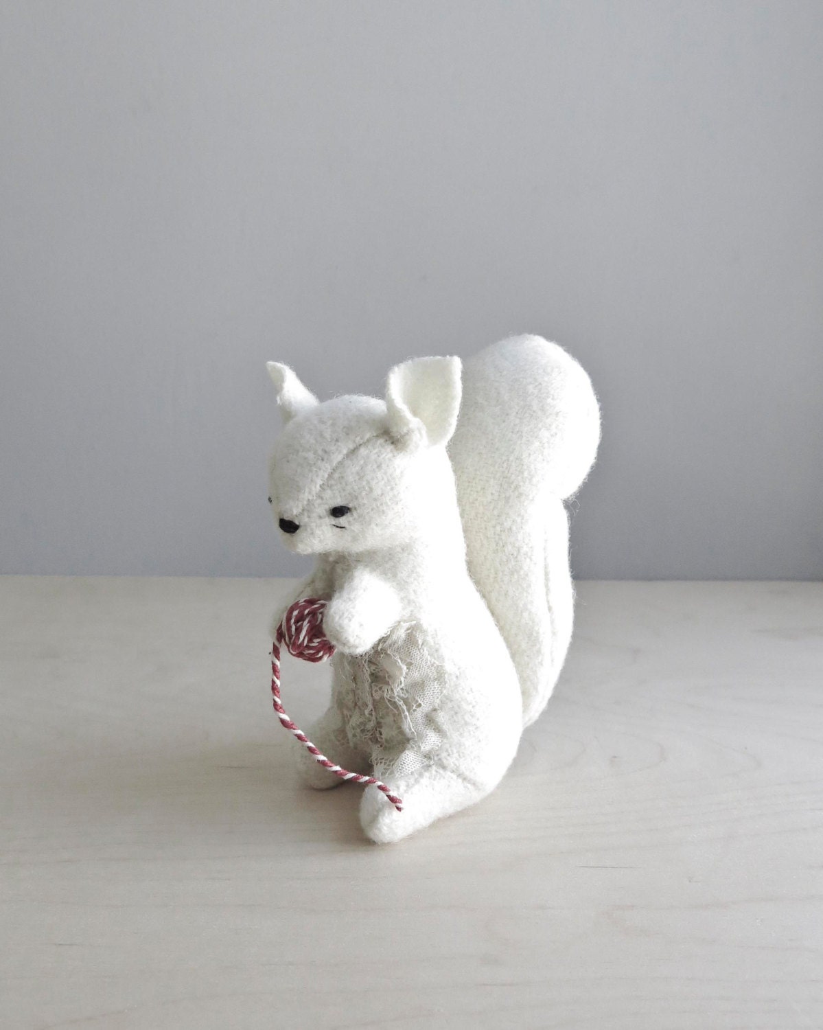 white squirrel with string / soft sculpture animal